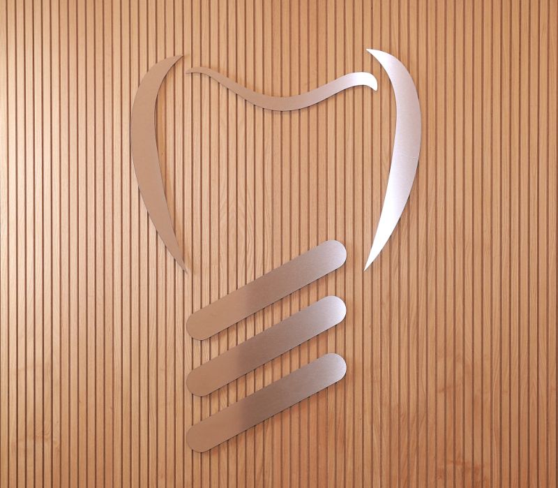 Logo in Zahnform der Zahnarztpraxis Dr. med. dent. Michael Hansmann & Kollegen